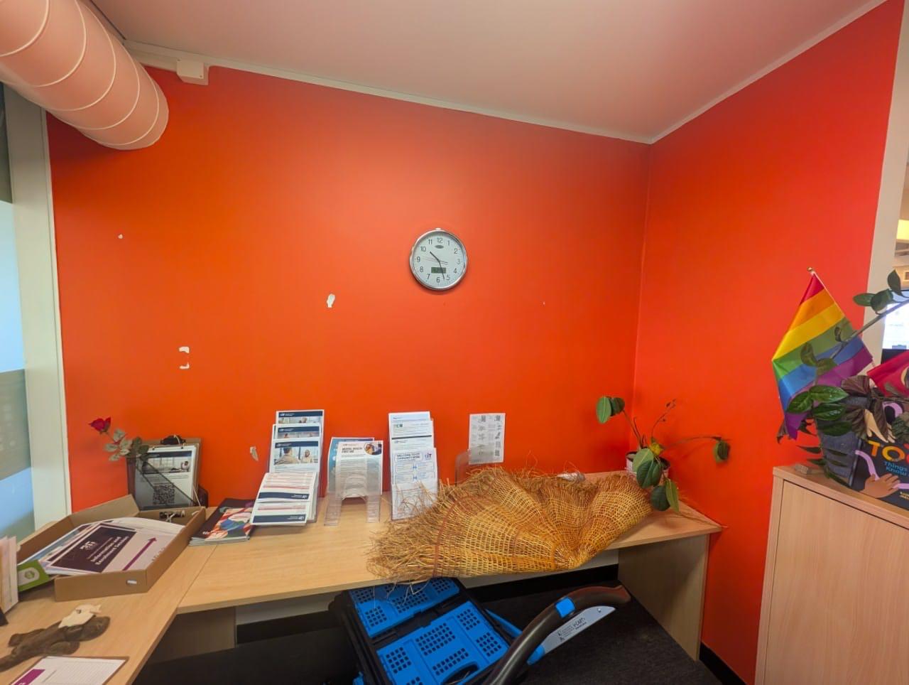 Bold orange feature wall repaint in a Canberra childcare centre