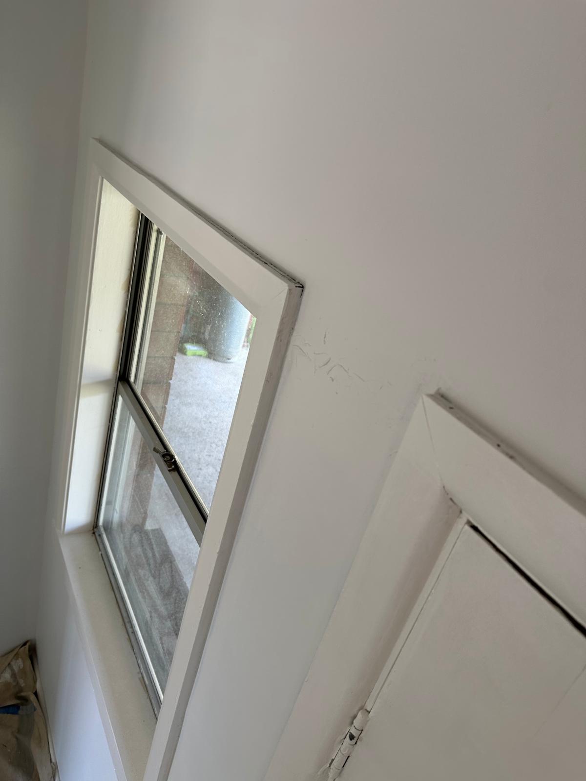 Freshly painted feature entry door with a glass panel