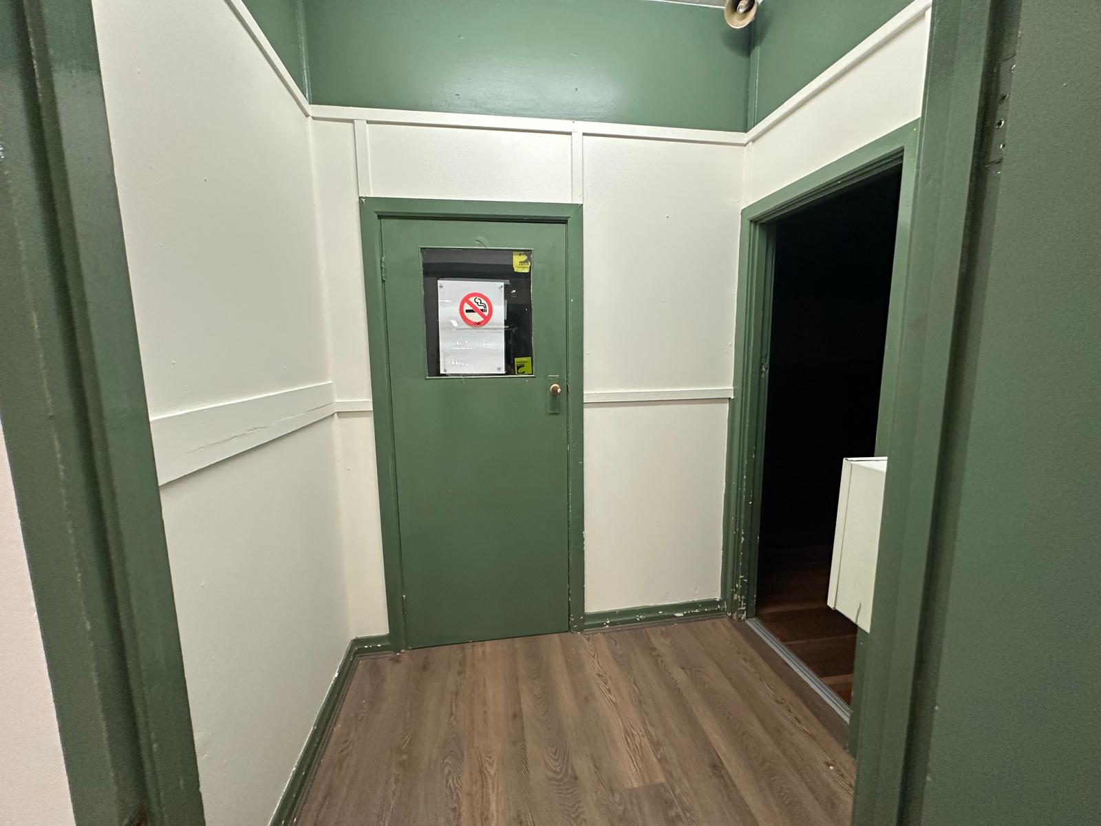 Restored corridor finished in heritage green and white