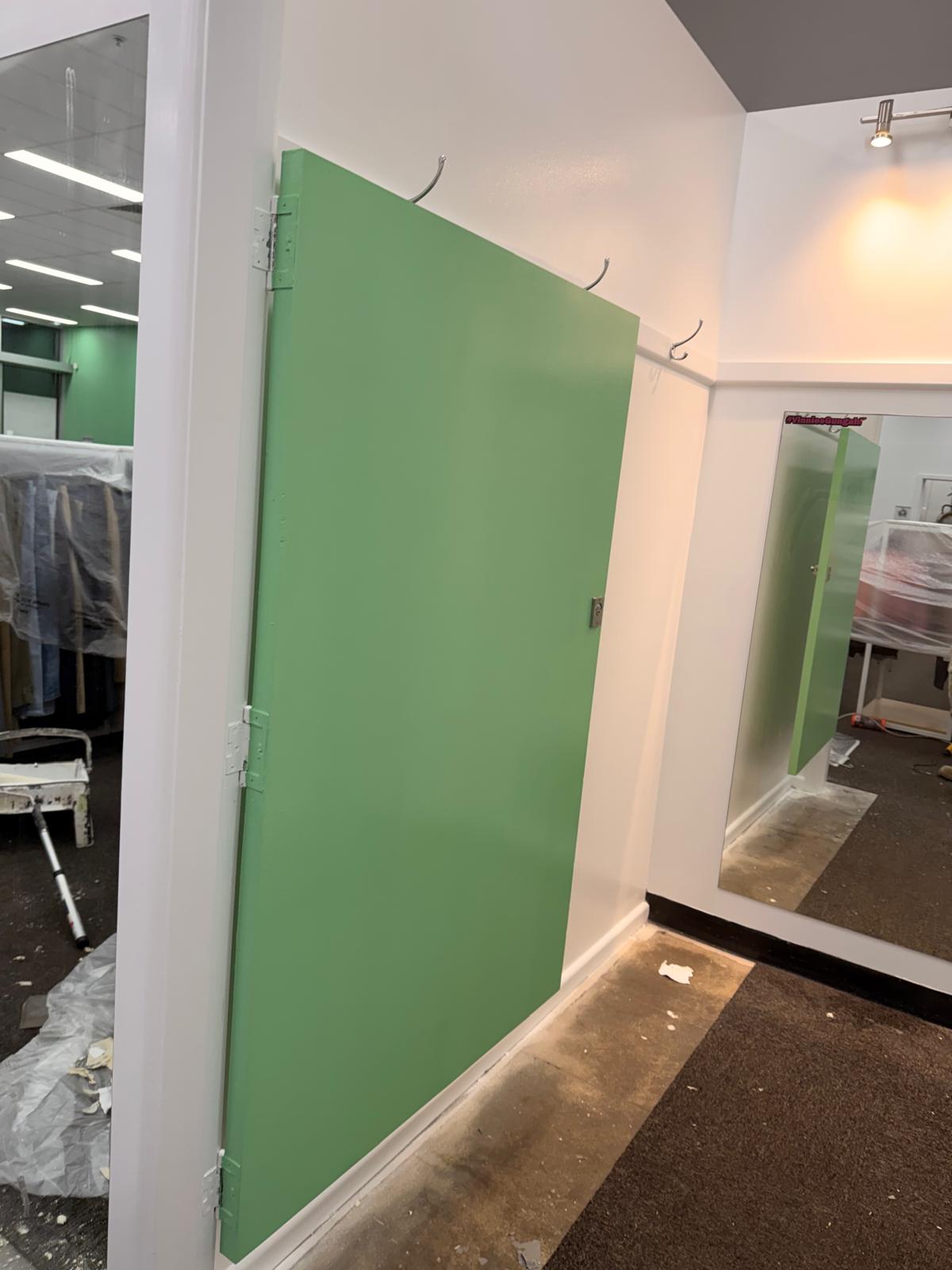 Freshly painted white corner finish near the staff entrance